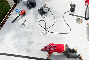 Man Working On a Roof